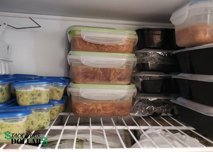 Inside a freezer with meal prepped soup and guacamole